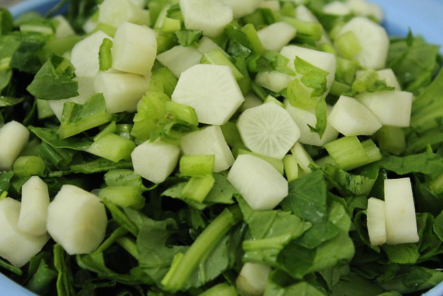 adding-chopped-radish adding chopped radish for palak saag