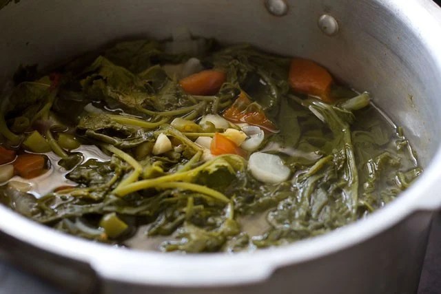 sarson-ka-saag8 pressure cooked greens and veggies in the cooker base for making sarson ka saag.
