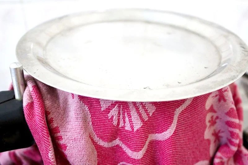 lid-on-top Lid sitting on pan of rice sealed with red cloth