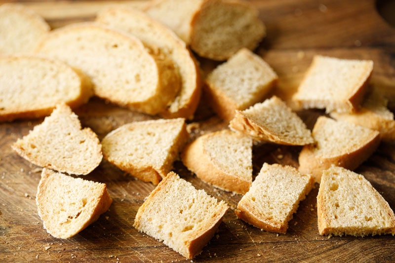 bread sliced on a wooden cutting board