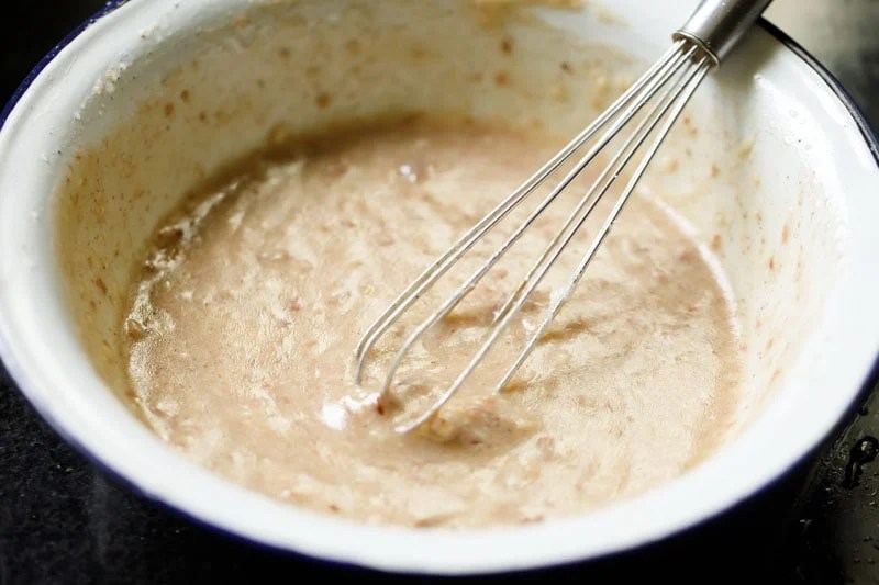 whisk in a bowl of vegetarian caesar salad dressing