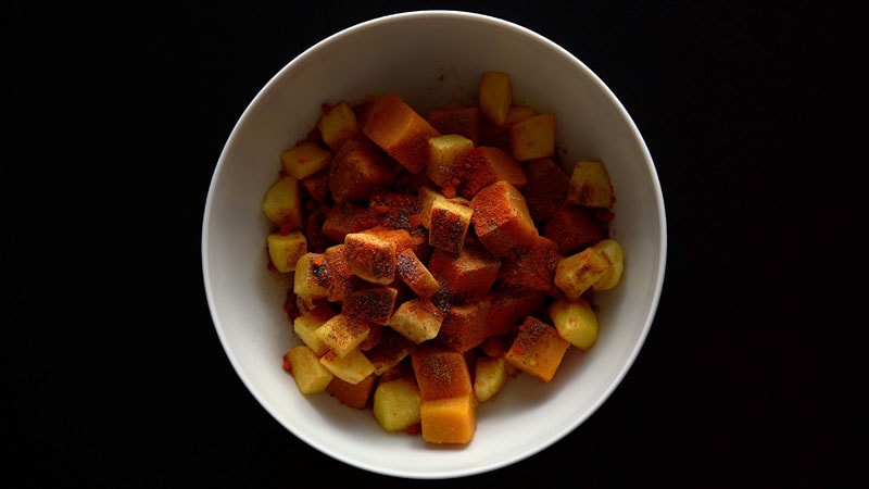 cumin powder, chaat masala, black salt and red chilli on fruit and tubers