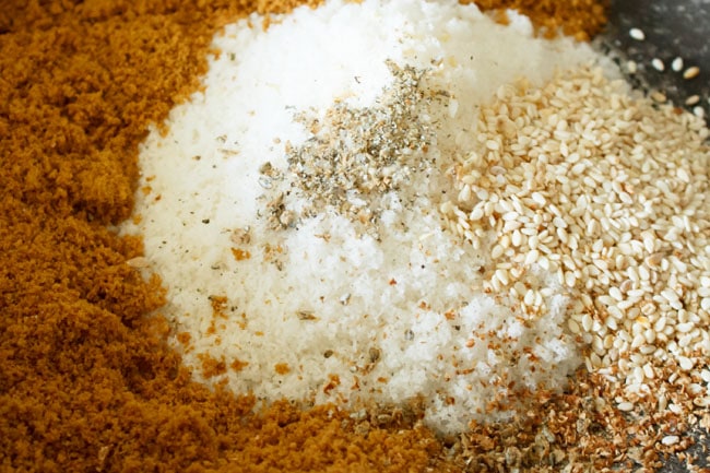 fried-modak4 jaggery, coconut, cardamom powder and white sesame seeds in pan