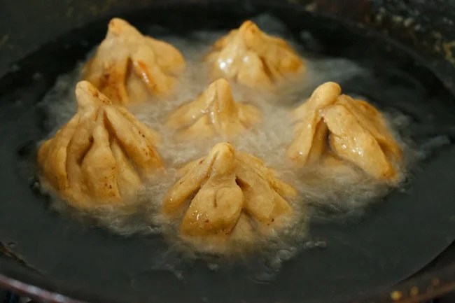 fried-modak15 frying modak in hot oil in pan