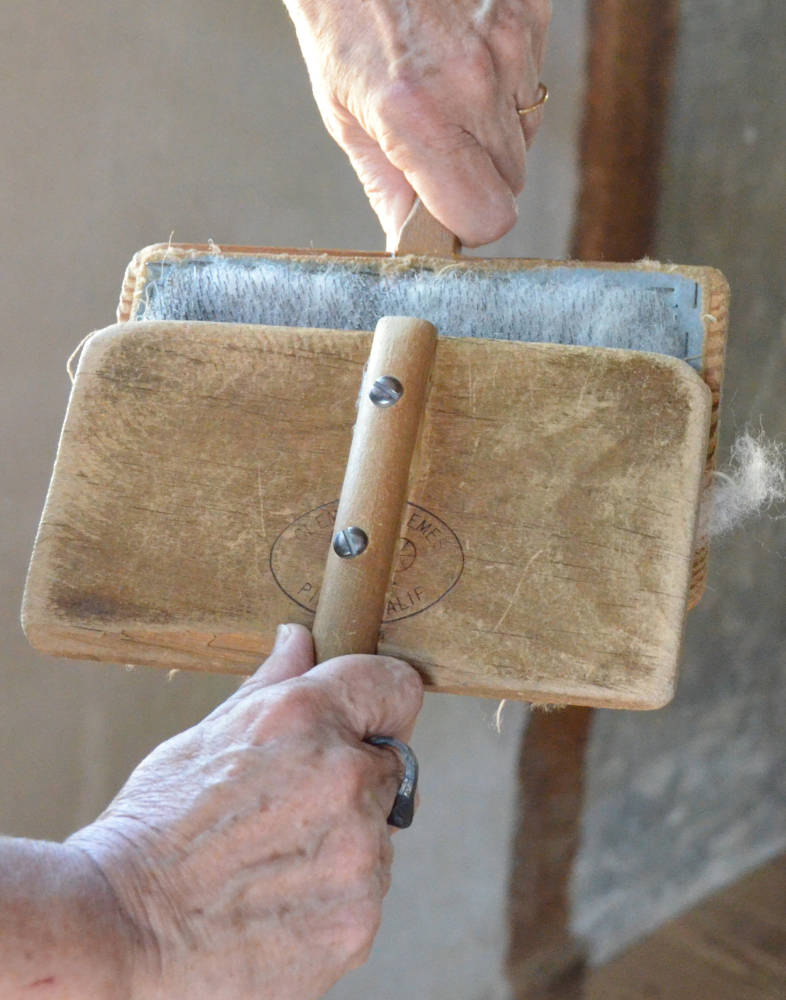 Carding wool by hand