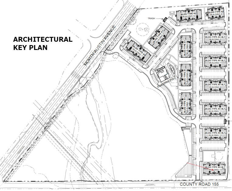 A new apartment complex, with a piece of land zoned for commercial