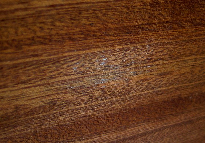 White specs in lacquer finish