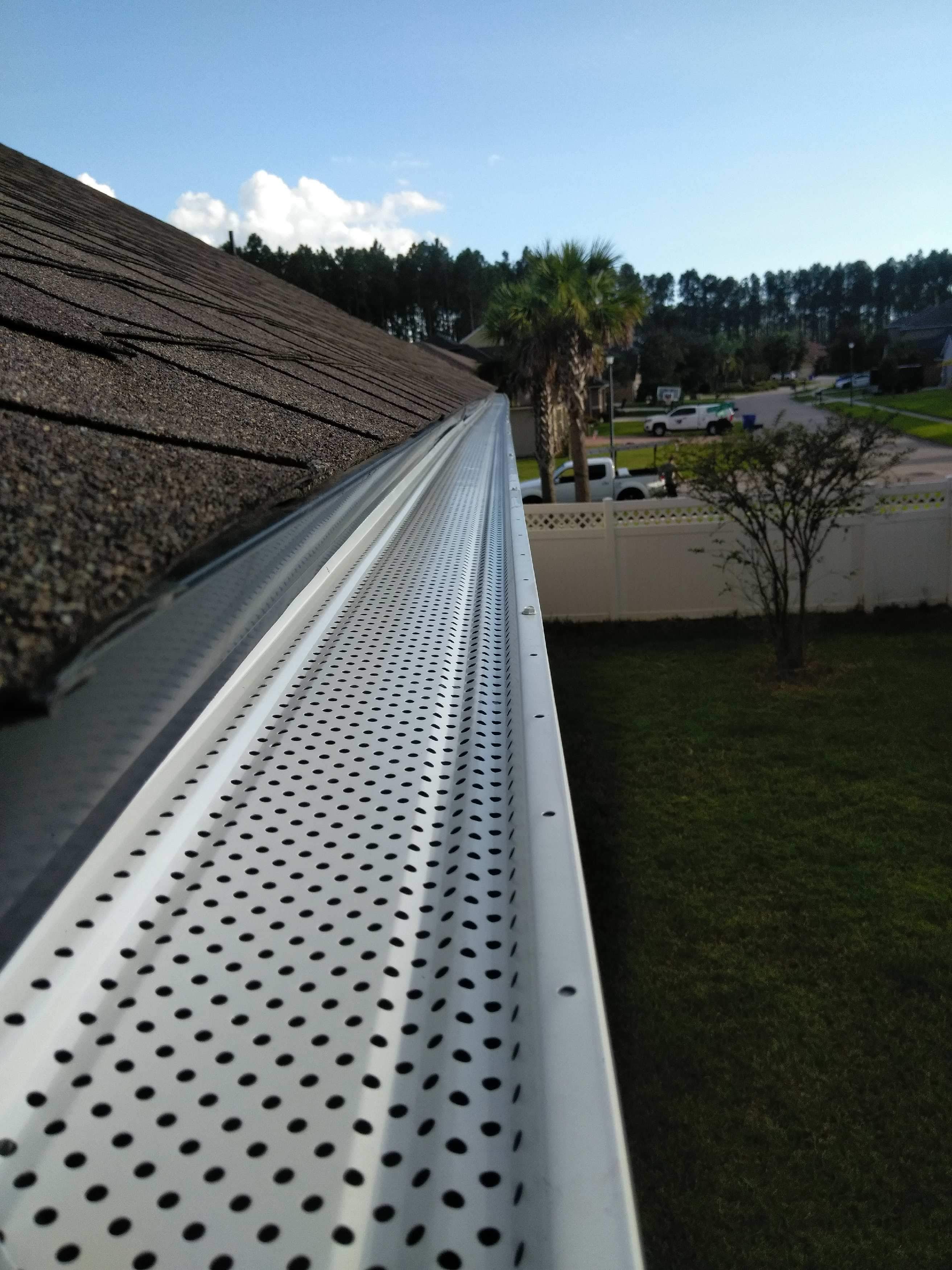 New storm gutter installation with leaf guards WeatherTek, LLC