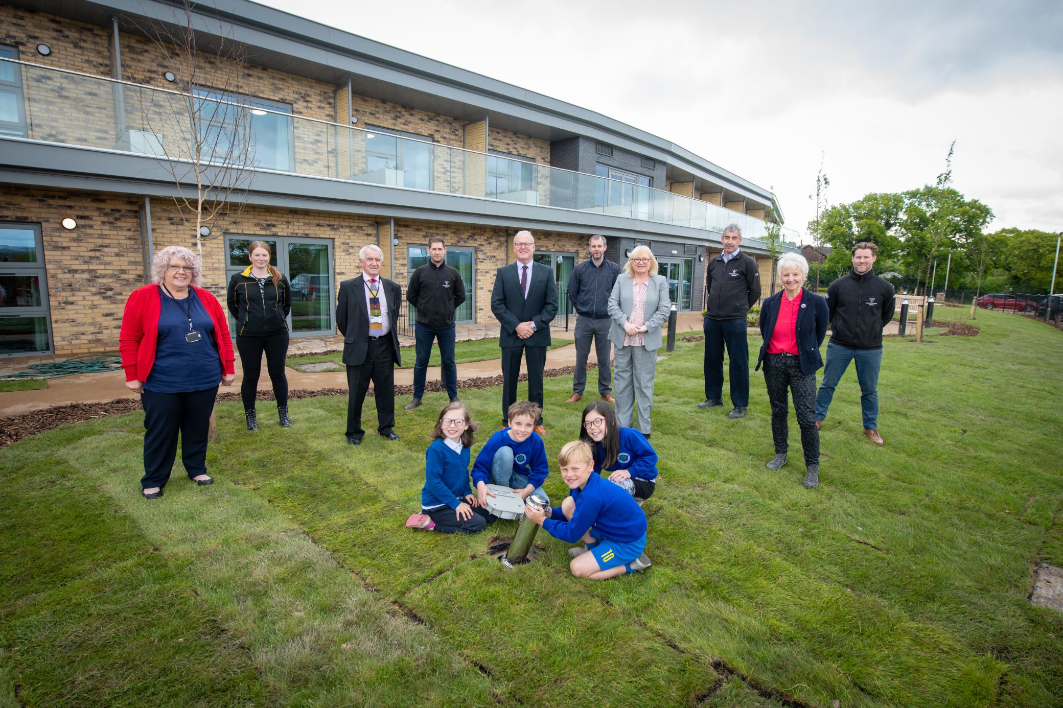 Schoolchildren bury time capsule to celebrate completion of Marleyfield
