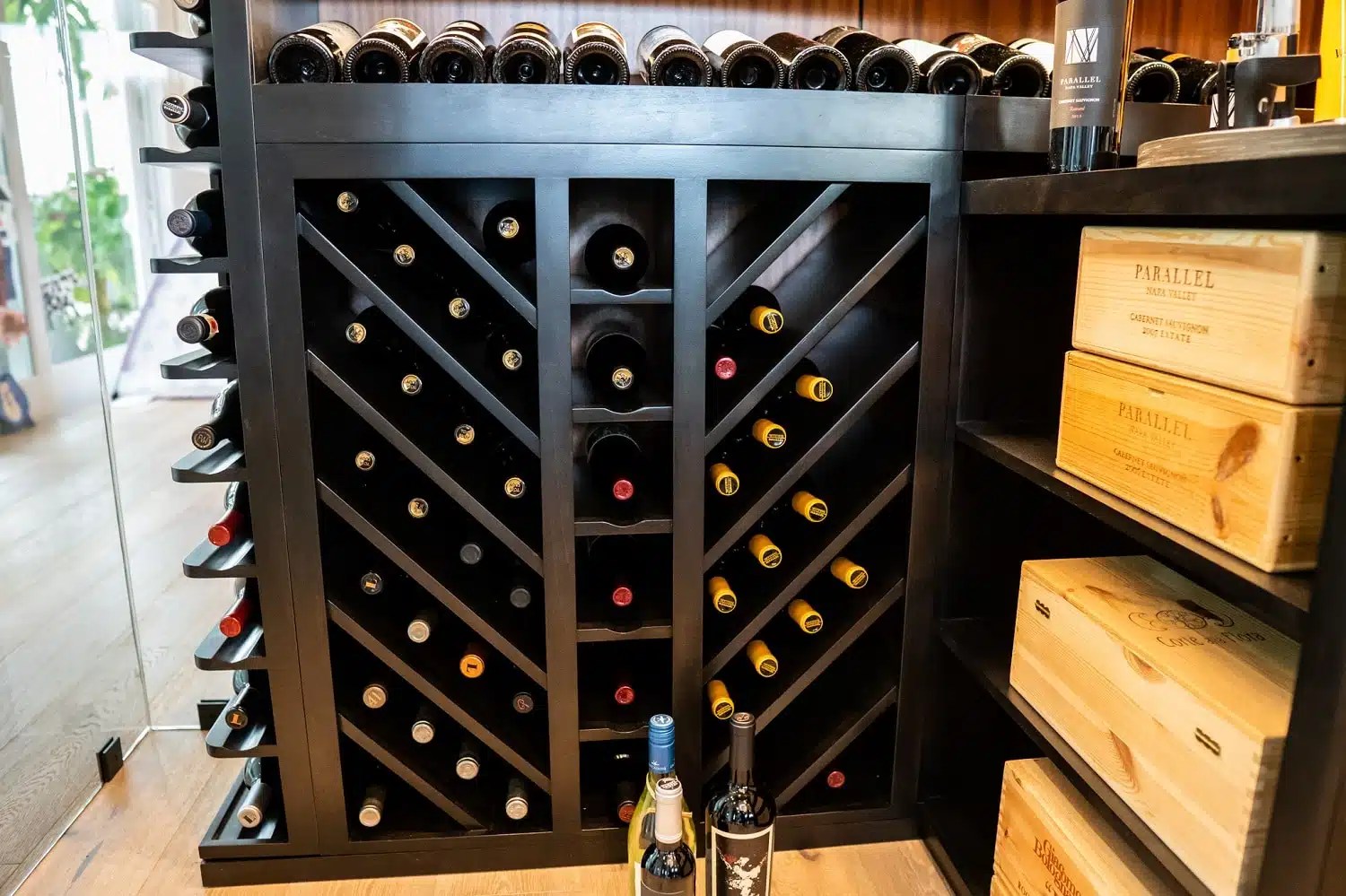 A Stunning Transitional Glass Wine Cellar in a Modern Home Wine