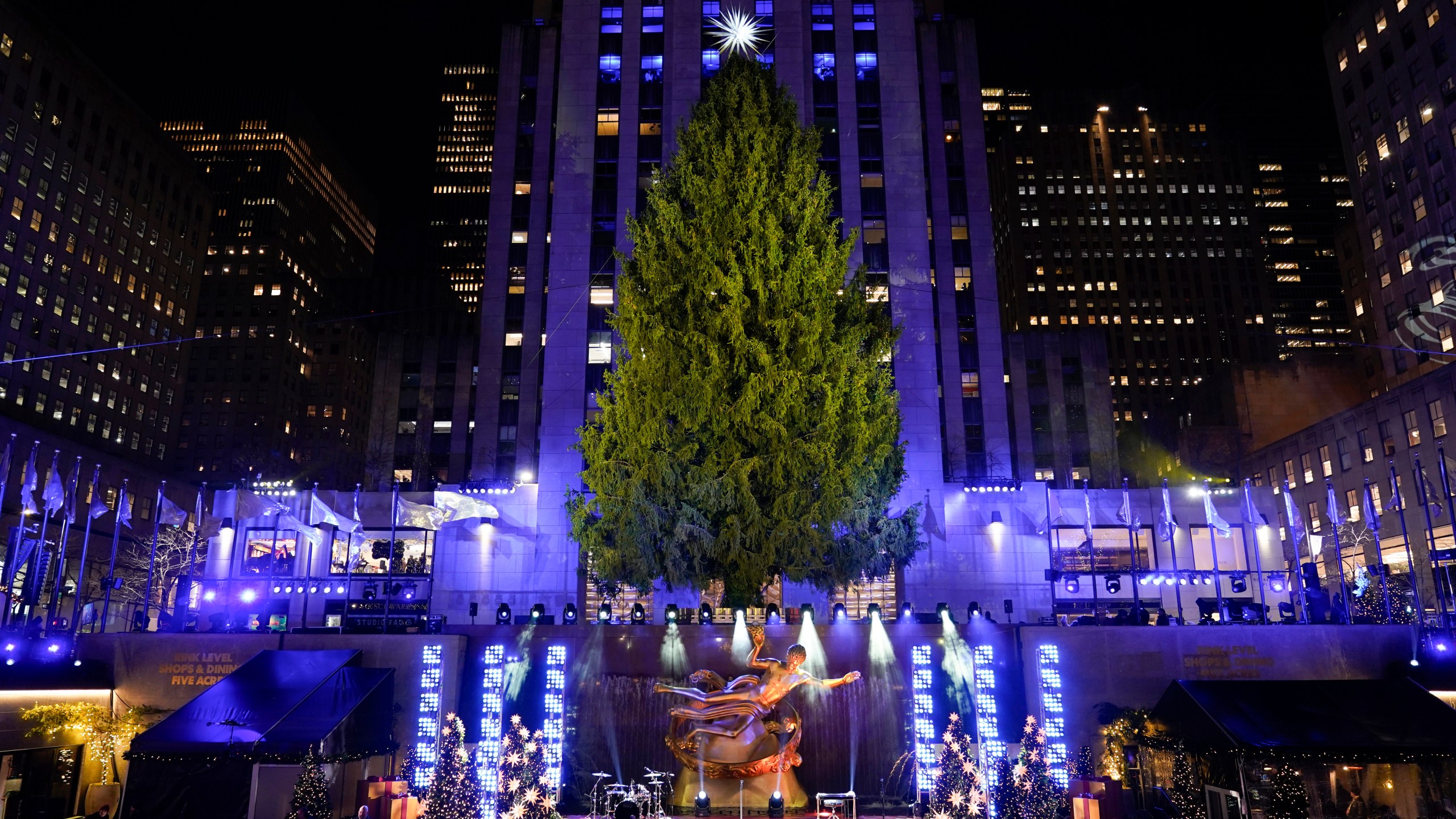 Iconic Christmas tree at Rockefeller Center illuminated in midst of pro