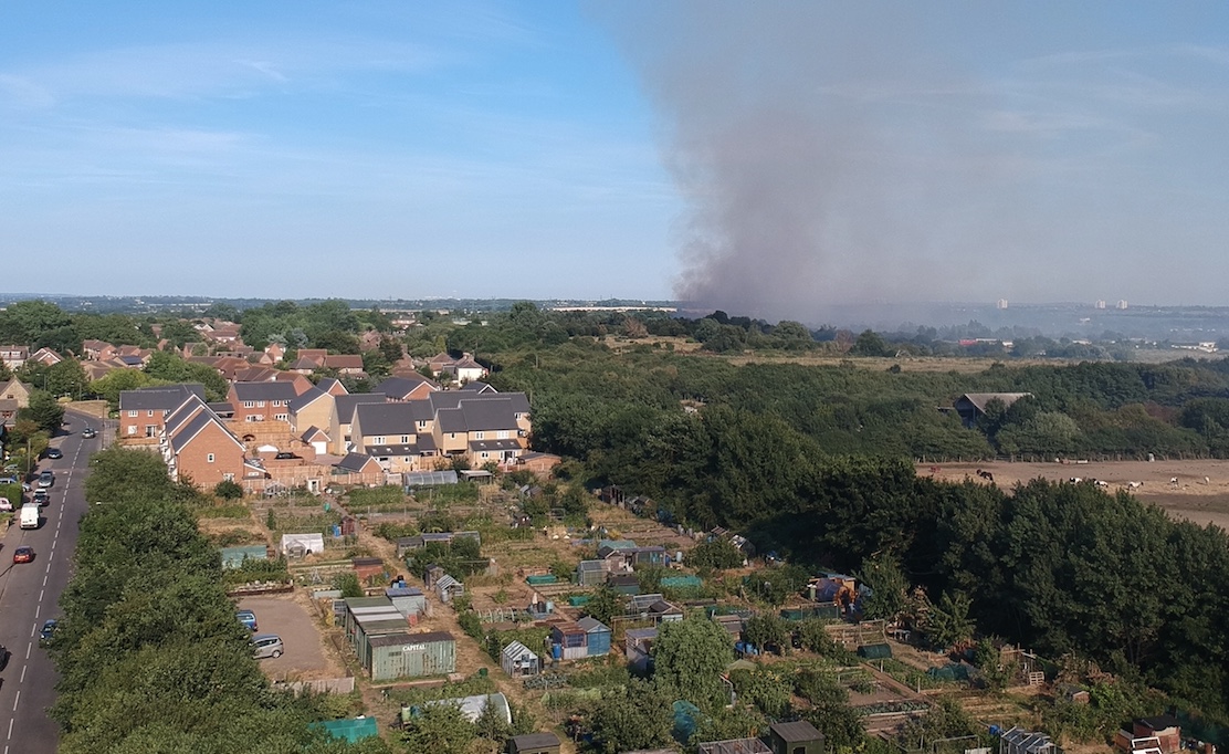 Buckles Lane showmen hand over cheque to firemen who saved their homes