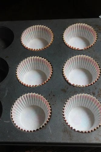 muffin tray lined with cupcake liners