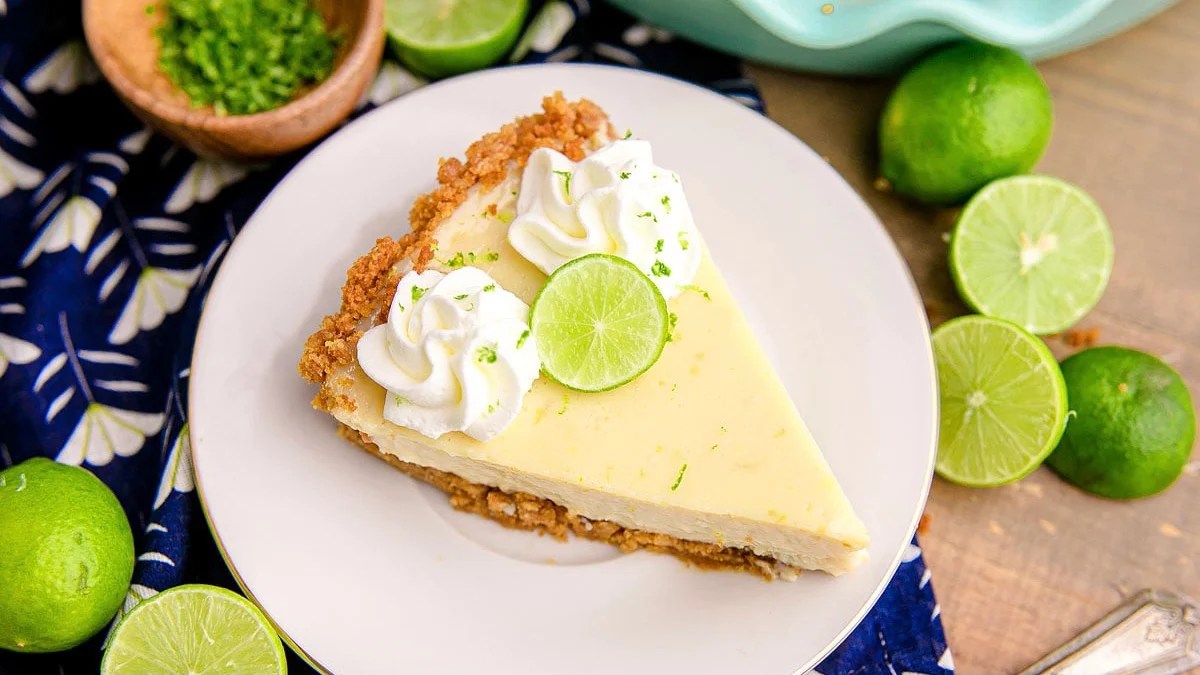 A slice of key lime pie on a plate.