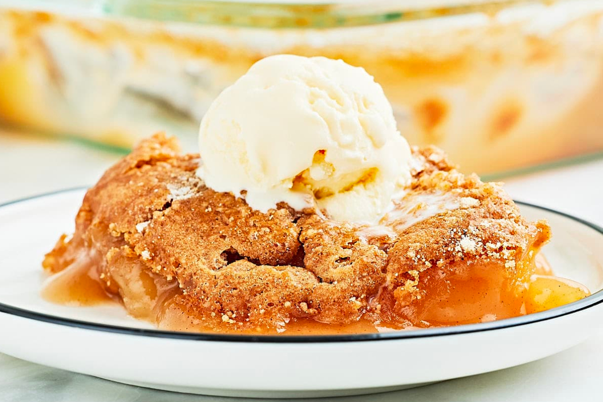 A plate with a scoop of ice cream and a slice of apple cobbler, perfect for indulging in delicious dump cakes.