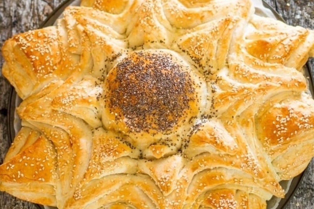 A Turkish bread with sesame seeds on top, perfect for bread recipes.