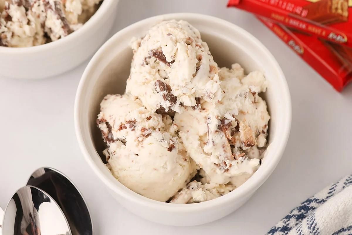 A bowl of cookies and cream ice cream with chocolate candy pieces from our ice cream recipes.