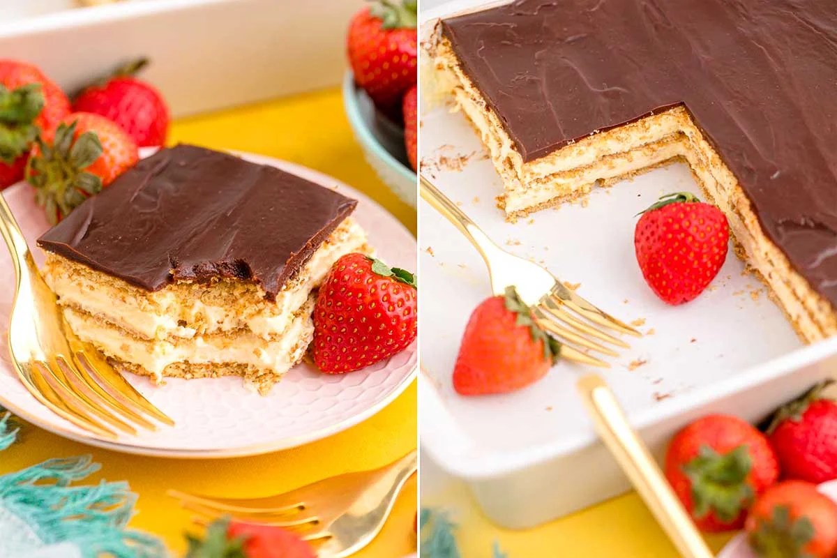 A sliced piece of creamy layered dessert made with pudding mix and chocolate topping, served with strawberries, alongside a partial view of the whole dessert.
