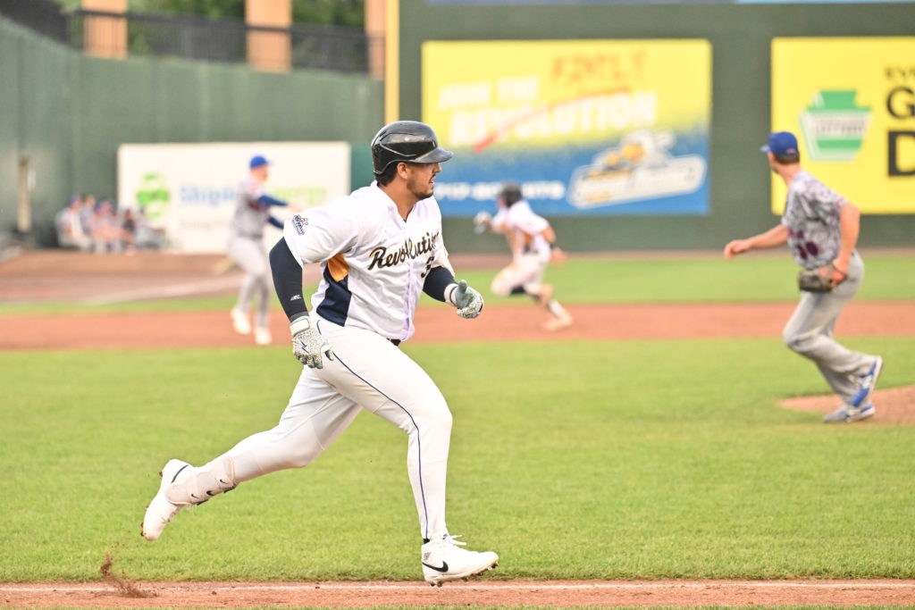 Revs Battle Back to Beat Rockers for Sixth Straight