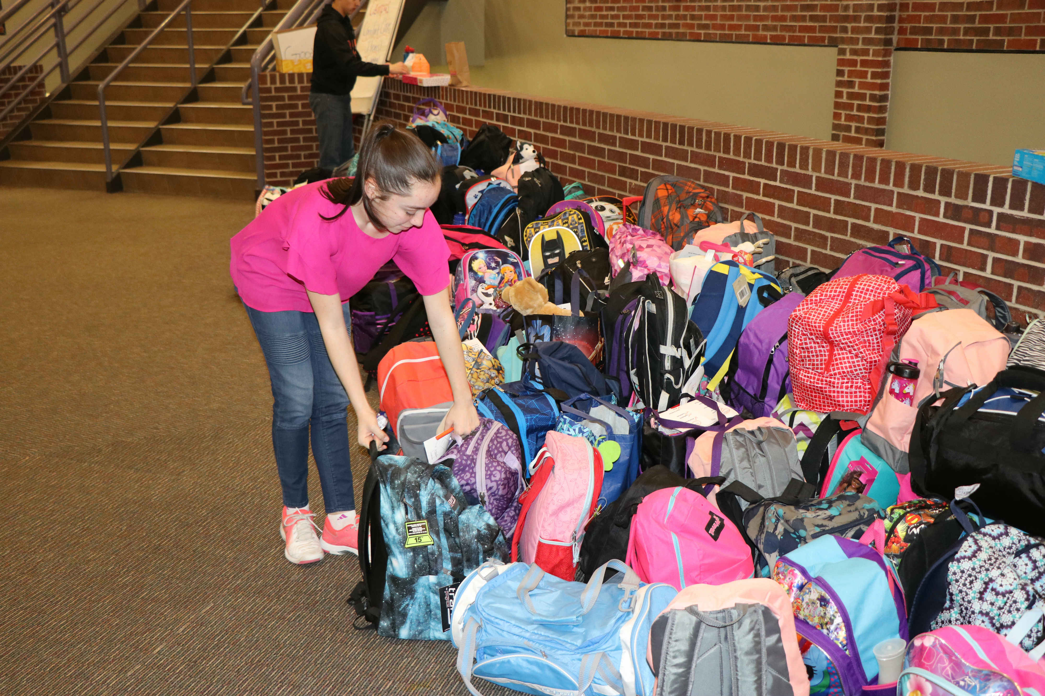 CMS assembles care backpacks for foster children YourHub
